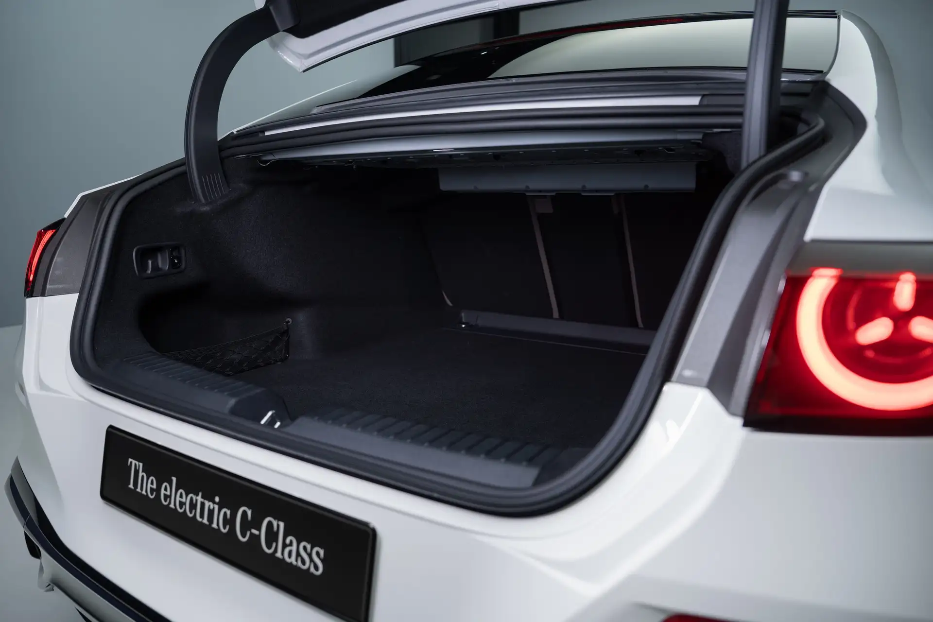 2027 Mercedes Benz C Class EV - White Electric Car Open Trunk With Red Tail Lights