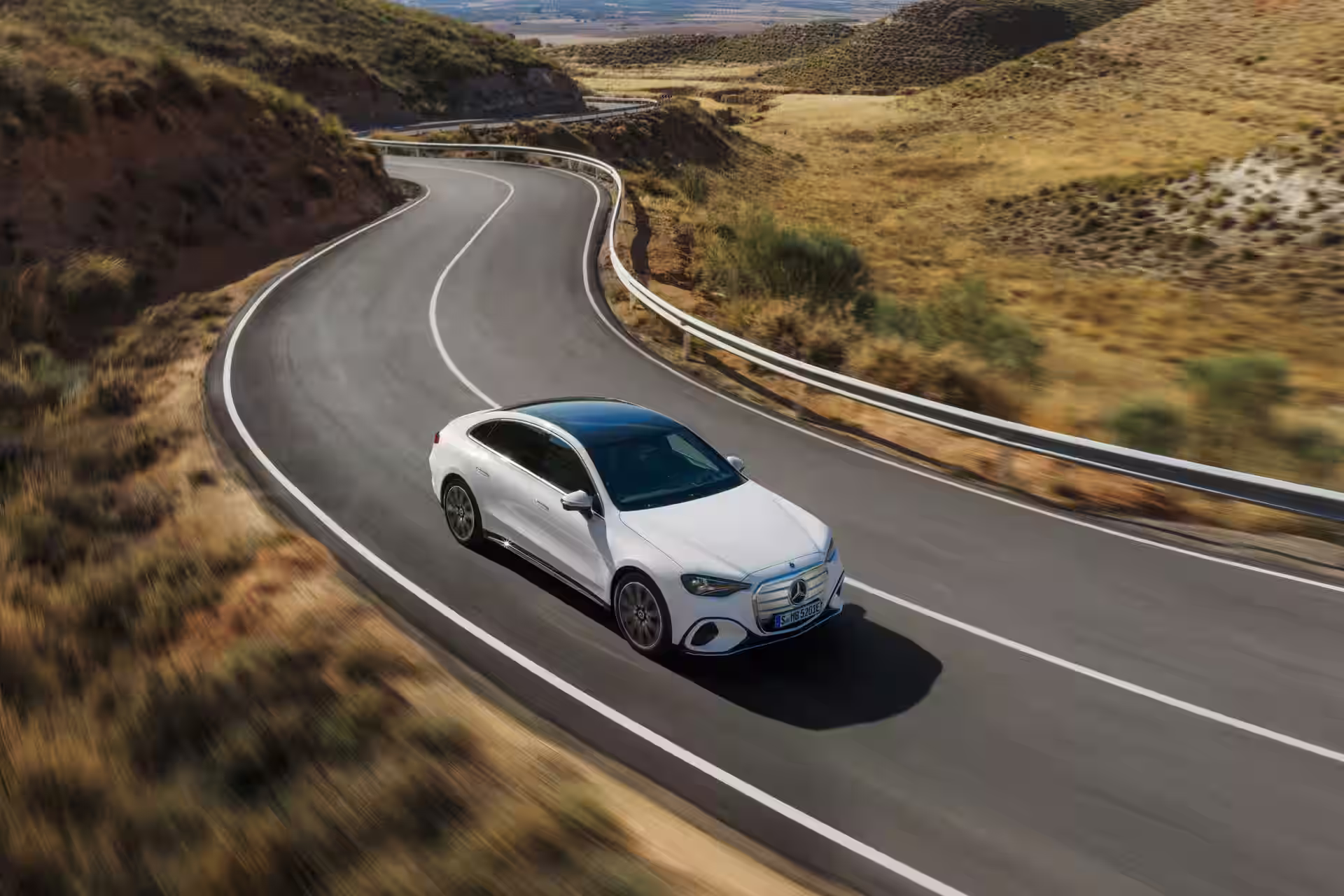 2027 Mercedes Benz C Class EV - White Mercedes AMG Touring Coupe On Curving Road