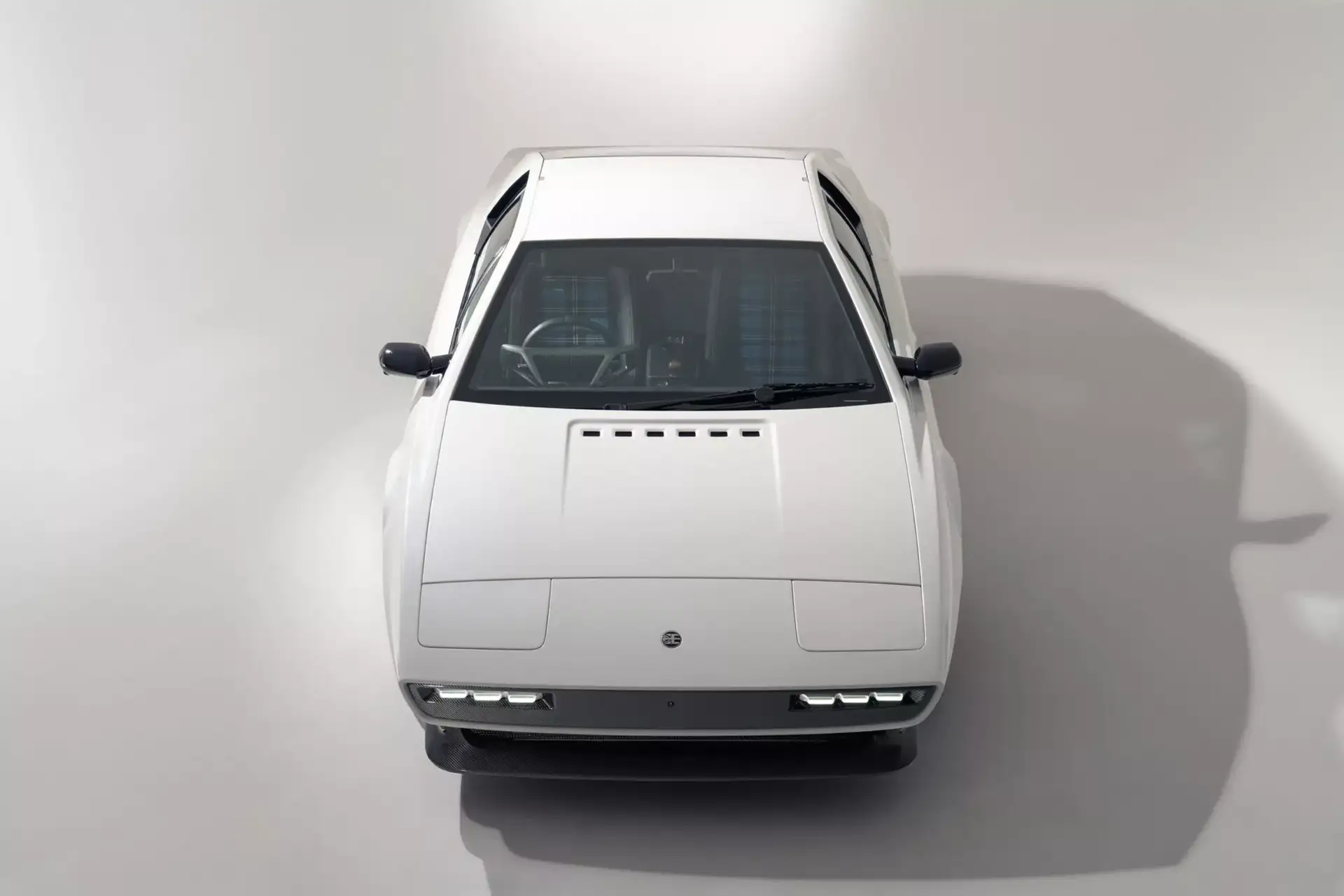 LOTUS ESPRIT Encor’s - Sleek White Supercar Front With Louvered Hood