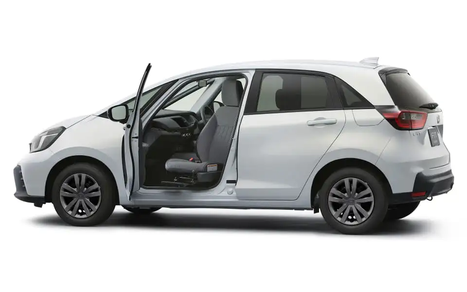 Honda Fit Z Ehev - White Compact Car Side Profile With Open Door